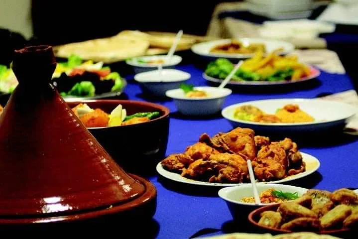 Traditional Moroccan dishes — tagine, couscous, and pastilla